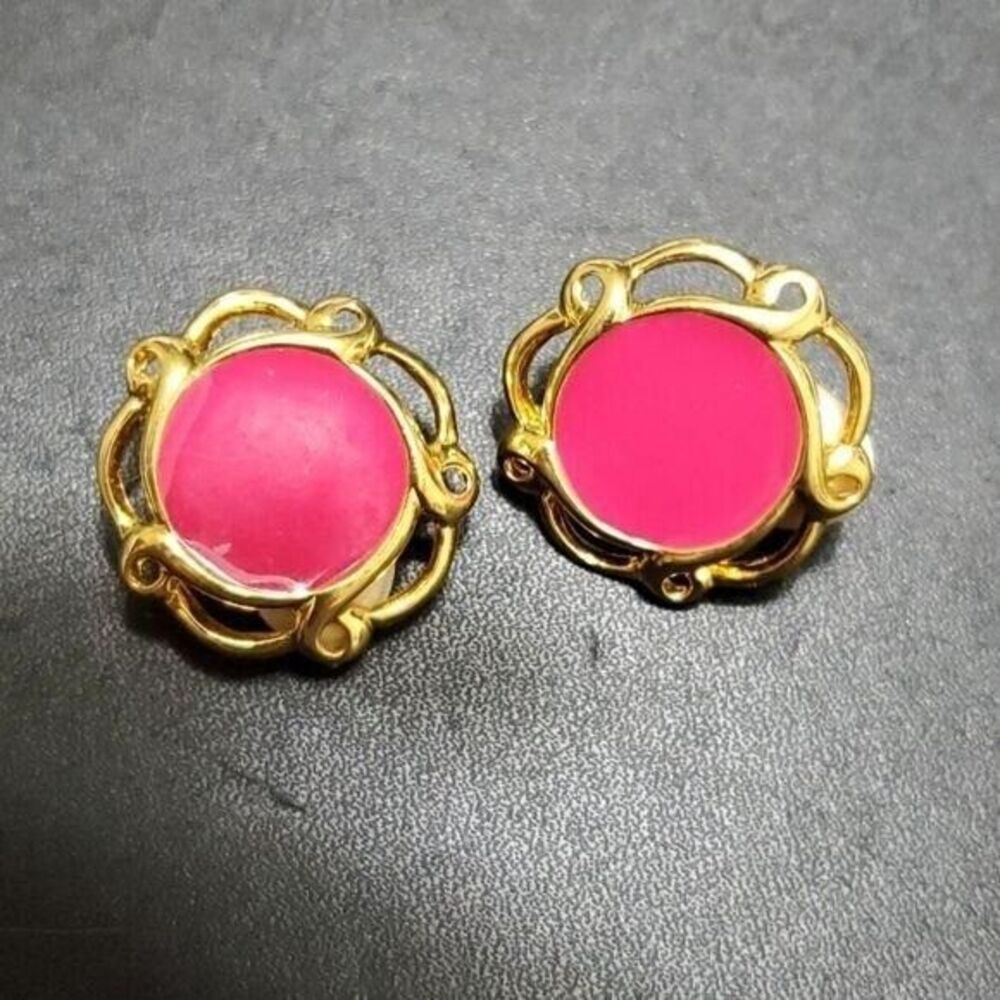 JS gold tone clip on earrings with pink enamel